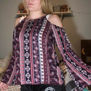 A long sleeve, patterned shirt